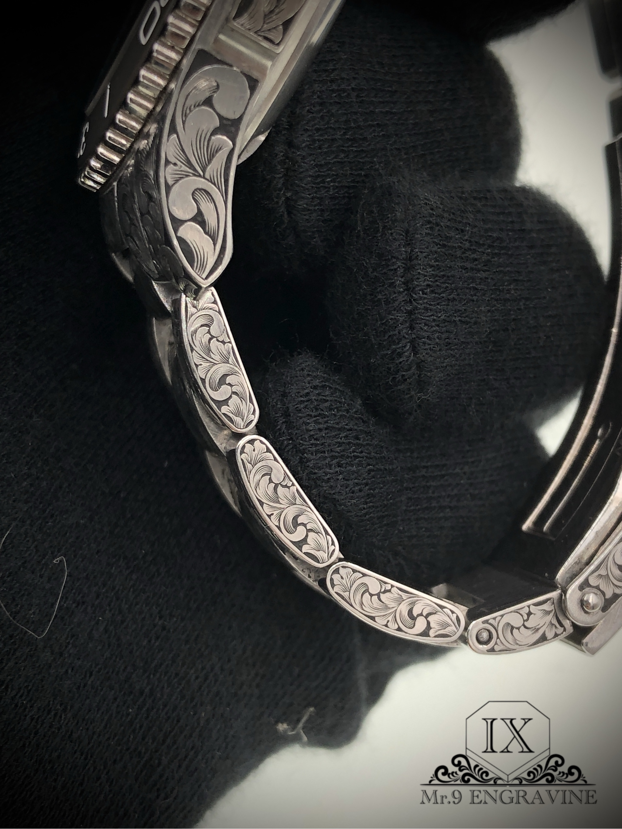 Floral scrollwork on the Longines bracelet