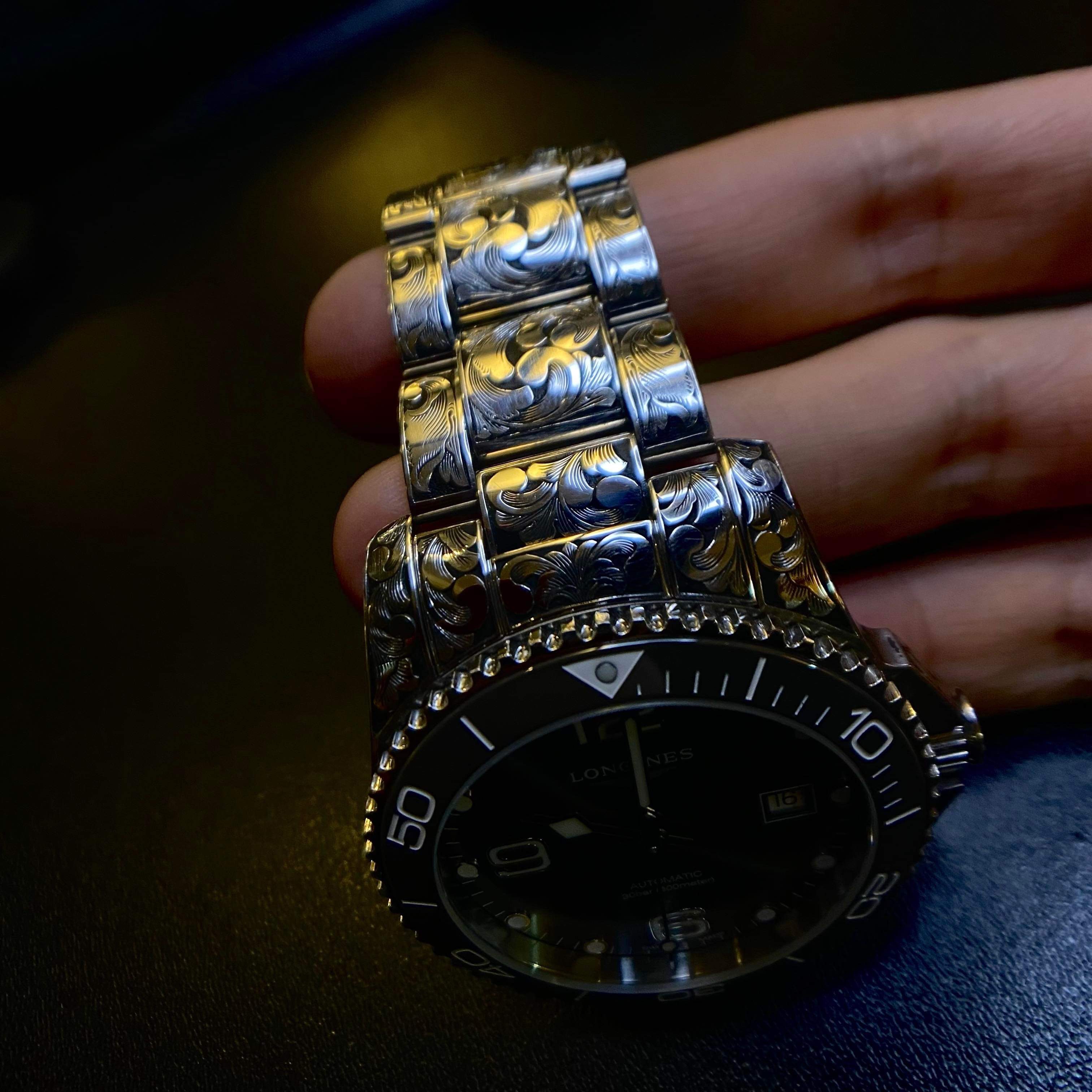 Hand-cut Longines watch engraving