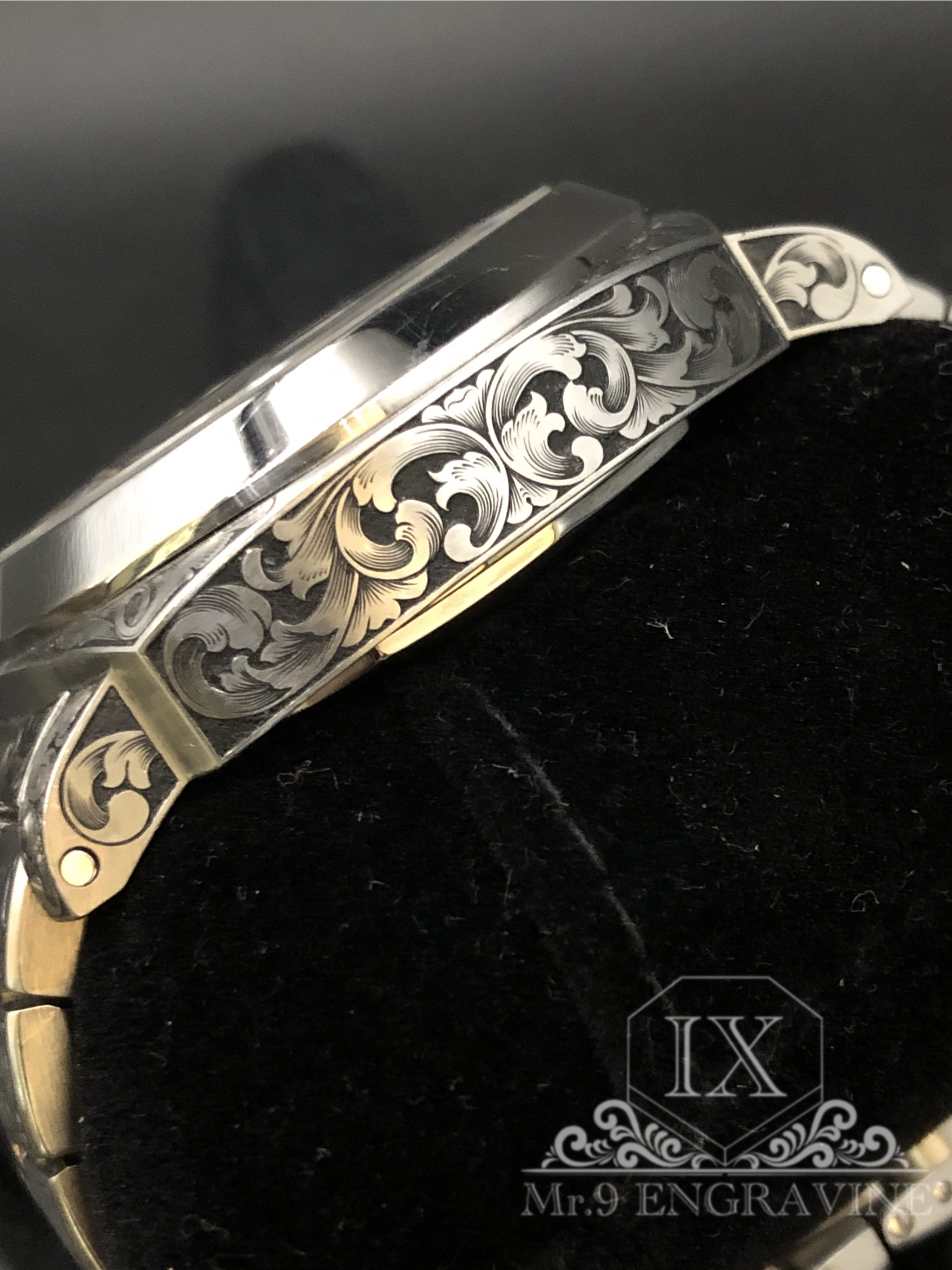Floral scrollwork and lug detail