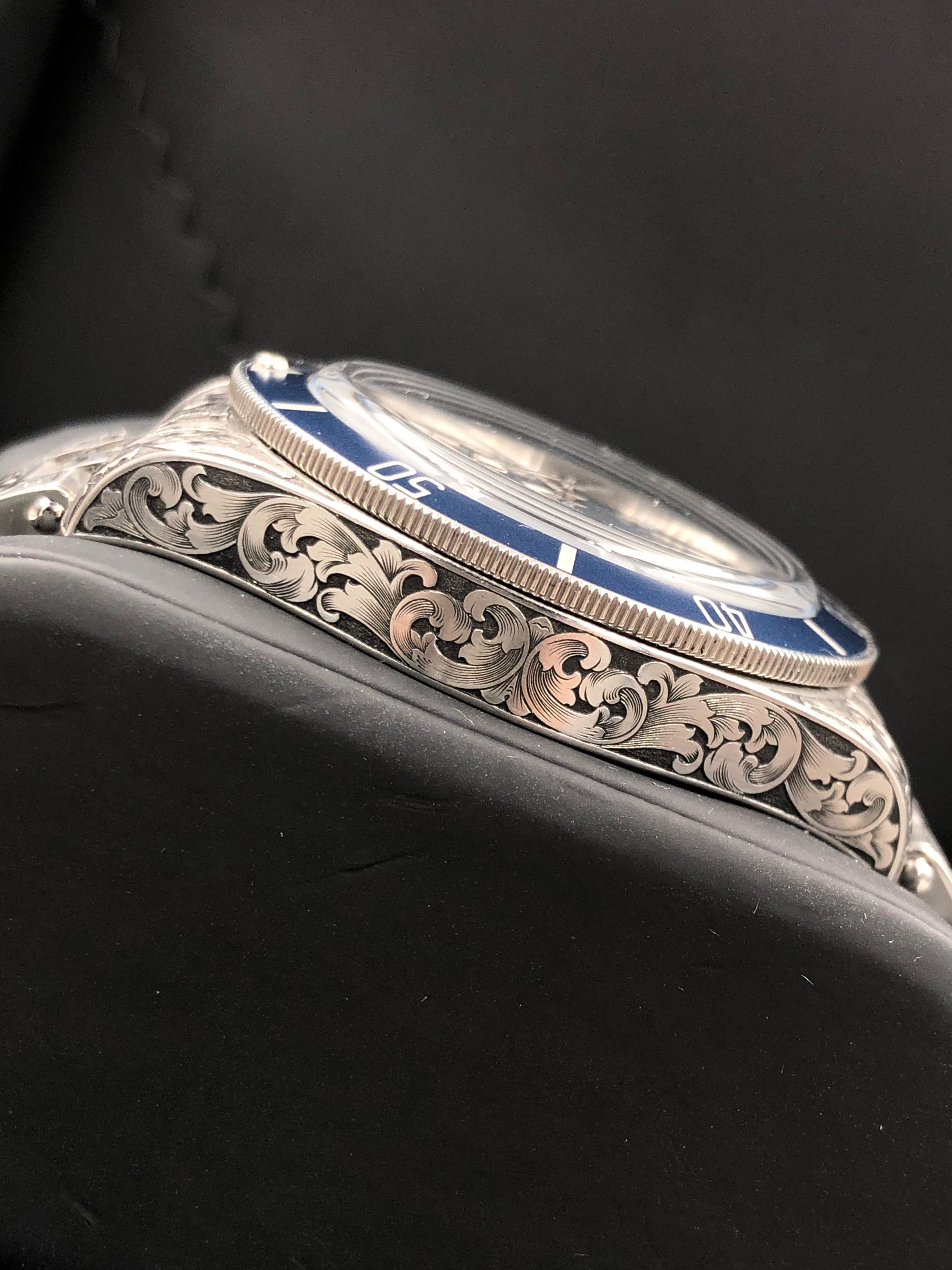 Koi and cherry blossom engraving detail
